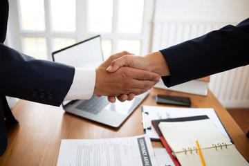 The lawyer shaking  hand agreement for consult preparing the phrase to be law for people who come to listen to counseling to receive social justice..concept of business