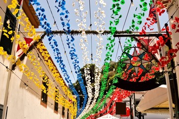 Streets of Sao Vicente decorated with colored paper flowers for a traditional festival (Madeira, Portugal, Europe)