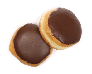 Doughnuts with chocolate cream icing isolated on white background, top view