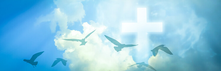 Christian cross appeared bright in the sky with soft fluffy clouds, white, beautiful colors. With...