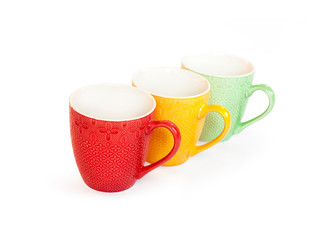 Colorful mugs isolated on white background