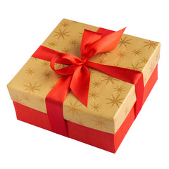 Red gift or present box with golden colored top and red ribbon bow isolated on white background