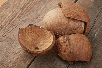 Coconut pieces pile on a wooden background