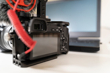 laptop camcorder blogger set on white table