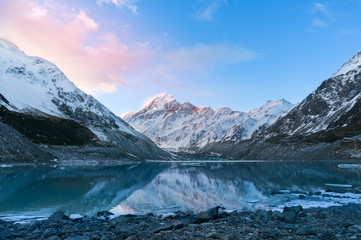 Fototapeta na wymiar Winter mountain landscape with glacier lake at sunset