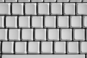 Close up shot of blank keys of white computer keyboard.