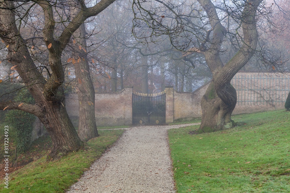 Poster Scenery of a gate leading to a mysterious garden