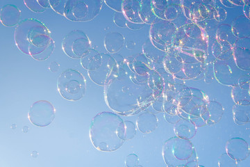 soap bubbles on a background of blue sky. selective focus