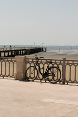 tourist bike in front of sea beach in city center andernos France