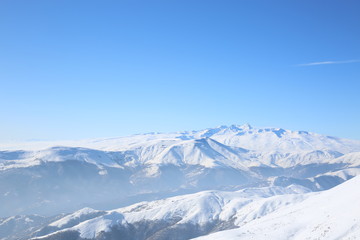 Fototapeta na wymiar Tsaghkadzor ski resort in Armenia. Beautiful view of the mountains on the top of Tegenis mountains.