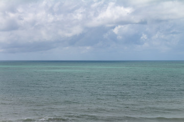 horizon line in the sea. storm clouds over ocean water.