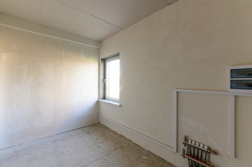Russia, Moscow- September 10, 2019: interior room rough repair for self-finishing. interior decoration, bare walls of the room, stage of construction