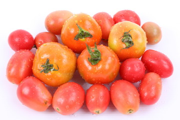 Tomatoes with water drops isolated on white background