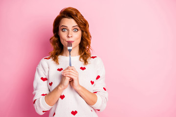 Close-up portrait of her she nice attractive pretty funny hungry cheerful wavy-haired girl licking fork want wish tasty yummy meal seduction healthy regime isolated on pink pastel color background