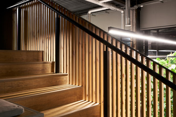 Wooden modern staircase in the loft style indoors