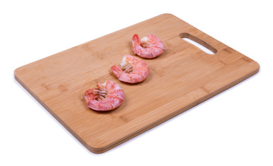 shrimp on a wooden board