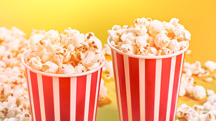 Closeup of two red paper baskets with popcorn