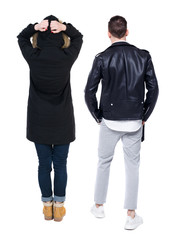 Back view of couple in winter jacket.