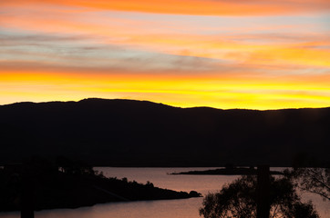 Bright oranges sunset by the Jndabyne lake
