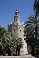 Fototapeta na wymiar Seville landmark Golden tower of Torre del Oro on the Guadalquivir seafront, Moorish tower, built to protect the harbor of Seville in 1220