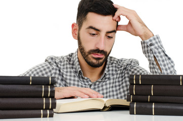 The young student with the books. Isolated on a white background 