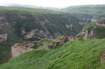 Fototapeta na wymiar Ruins of medieval fortress. Outskirts of Makazhoy village, Chechnya (Chechen Republic), Russia, Caucasus.