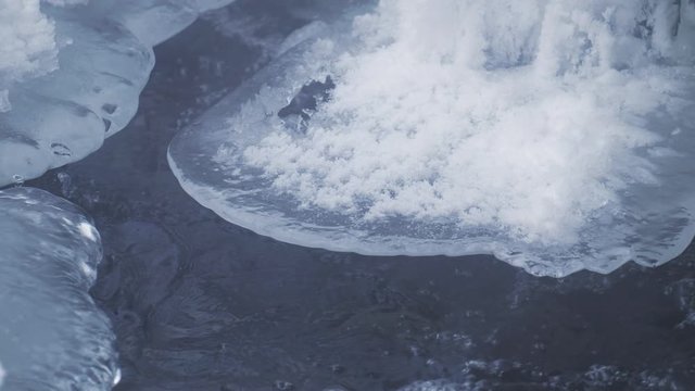 Video of  ice icicles over frozen river Pescherka