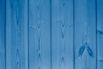 Old vintage wooden texture for background toned in trendy classic blue color. Color of the year 2020. Trendy color.