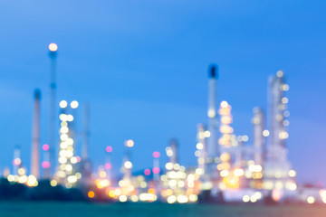 Abstract blur bokeh of oil gas refinery plant. May called petroleum, production or petrochemical plant. Industrial factory and engineering technology at night for business of power energy background.