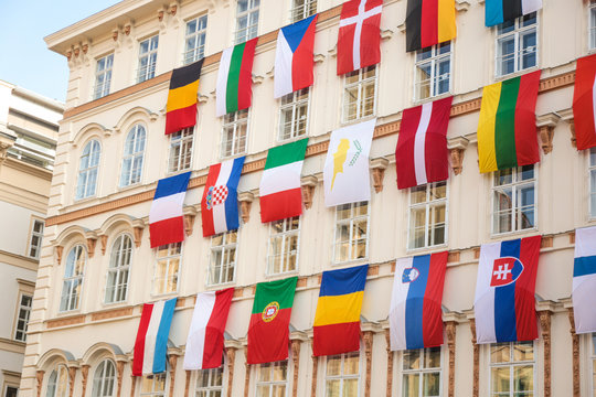 Set of European flags hanging on building with EU and UN flags in Vienna, Austria, Europe