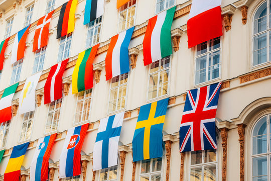 Set of European flags hanging on building with EU and UN flags in Vienna, Austria, Europe