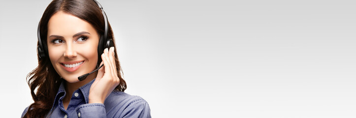 Call center customer support female phone operator or sales agent in headset, copy space for some...