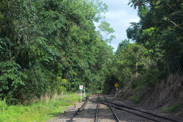 A railway junction with switch points and signs near Kuranda in Tropical NOrth Queensland, Australia