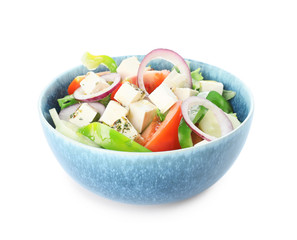 Bowl of tasty Greek salad on white background
