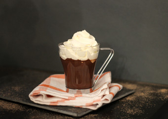 glass of hot chocolate on dark background