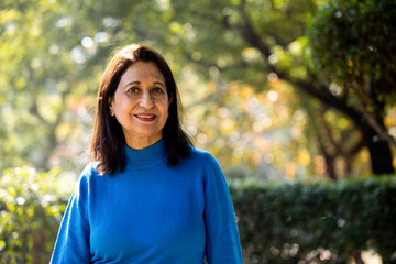 Confident senior woman looking at camera outdoor