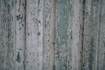 Cracked paint texture on old wooden wall.