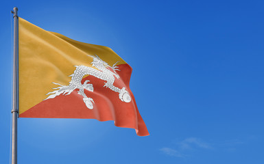 Bhutan flag waving in the wind against deep blue sky. National theme, international concept. Copy...