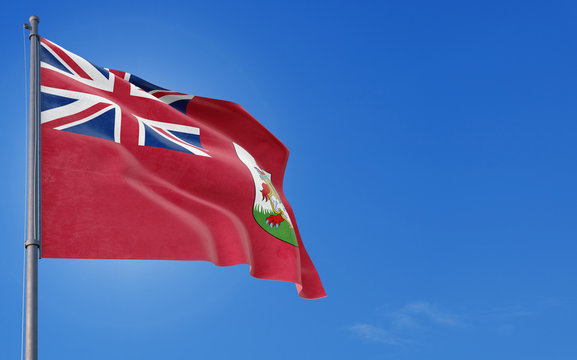 Bermuda flag waving in the wind against deep blue sky. National theme, international concept. Copy space for text.