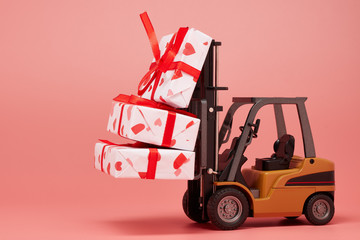 Forklift and gift boxes on pink background with copy space. Valentine's Day.
