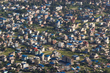 aerial view of the city settlement. Small houses and green glades