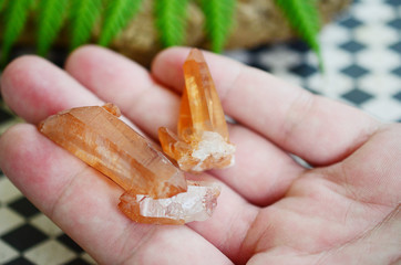 Tangerine Quartz in womans hand! Premium quality crystal Quartz healing stone, extremely unique crystal formation! Red Quartz Specimen, orange quartz stone. Rough crystal point, natural lighting