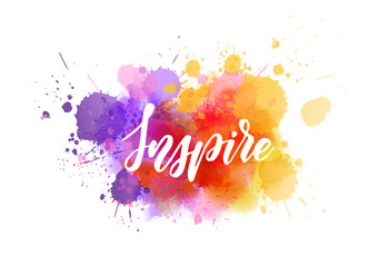 Inspire handwritten message on watercolor splash