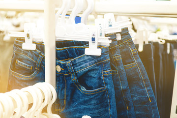 blue jeans on the counter of a children's clothing store. clothing for boys in the store