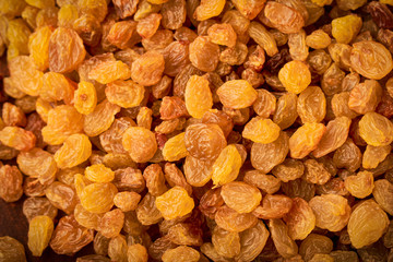 Top view raisins dried grapes as background texture: organic food concept