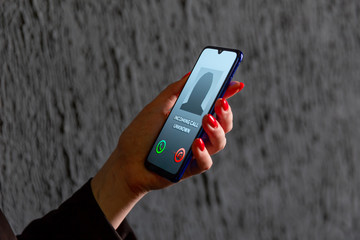 Phone call from unknown number. Scam, fraud or phishing with smartphone concept. Prank caller,...
