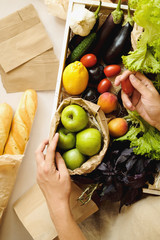 Organic vegetables and fruit in market. Woman seller with and products in organic food store.  Healthy nutrition, eating, Zero Waste, Lifestyle Concept. Banner for for web, design. Close up