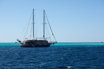 Fototapeta na wymiar Big ship with masts sailing in the Red Sea