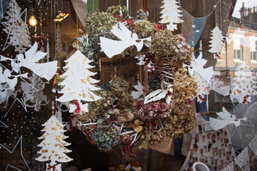 Christmas decoration for a shop window selling handmade and craft. Cardboard Angels and Wreaths