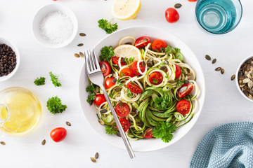 vegan ketogenic spiralized courgette salad with avocado tomato pumpkin seeds